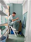 Doctor Taking a Break in Hospital Supply Room