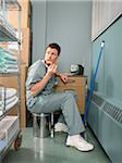 Doctor Taking a Break in Hospital Supply Room