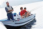 Man and Teenagers Fishing, Belgrade Lakes, Maine, USA