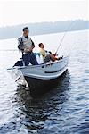 Man and Teenager Fishing, Belgrade Lakes, Maine, USA