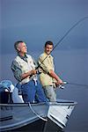 Man and Teenager Fishing, Belgrade Lakes, Maine, USA