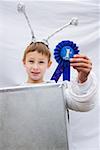 Boy in costume with winning rosette
