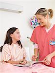 Nurse and Patient in Hospital Room