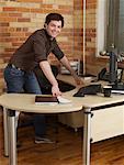 Businessman Standing Behind Desk