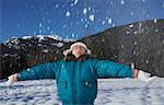 Girl Throwing Snow into Air