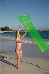 Woman on the Beach With Air Mattress