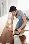 Man Installing Floorboards