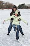 Man Catching Woman while Skating