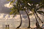 Tourist on the beach, Raiatea Island, Society Islands, French Polynesia