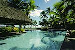 Swimming pool in front of stilt houses, Fiji