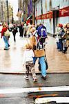 Group of people walking on the sidewalk