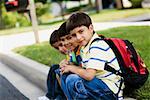 Portrait of three schoolboys sitting together