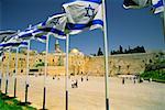 Israeli flags at a shrine and a dome in the background, Wailing Wall, Dome Of The Rock, Jerusalem Israel