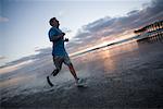 Man With Prosthetic Leg Running on the Beach
