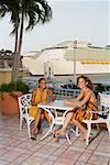 Portrait of two teenage girls sitting at a table