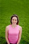 High angle view of a young woman doing yoga in a park