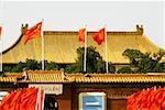 Chinese flag fluttering on a building, Forbidden City, Beijing China