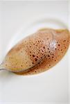 Close-up of a teaspoon in a cup of coffee