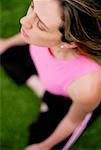 High Angle View of a young Woman sitting in der Lotus-position