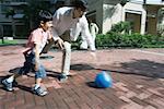 Father and son playing ball, blurred motion