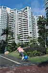 Boy playing ball in apartment complex