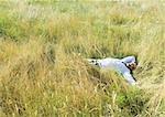 Man lying in field