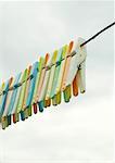 Clothes pegs hanging on clothesline