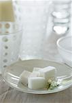 Sugar cubes in saucer