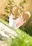 Senior woman stretching outdoors