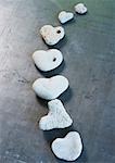 Heart-shaped stones arranged in curved line