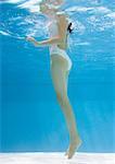 Teenage girl in pool, underwater view