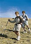 Two young men hiking down mountain