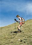 Girl hiking down mountain