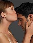 Woman Kissing Man's Forehead