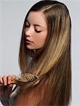 Young Woman Brushing Hair