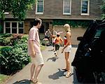 Extended Family Greeting in Driveway