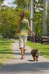 Girl Walking Dog