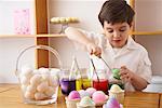 Child Making Easter Eggs