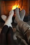 Couple's Feet by Fireplace