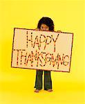 Little Girl Holding Thanksgiving Sign