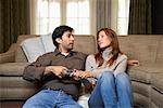 Couple Fighing Over TV Remote