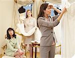 Woman in Bridal Boutique Looking at Price Tag