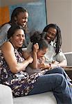 Family on Living Room Sofa