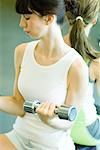 Woman lifting dumbbells