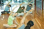 Exercise class doing seated side bend