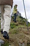 Senior adult couple hiking in the mountains (part of), low angle view