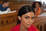 Young Indian woman in an auditory close-up, selective focus