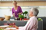 Blonde woman is making dinner for herself and her husband, selective focus