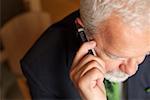 Mature businessman phoning with a mobile phone