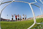 Boys running into Goal